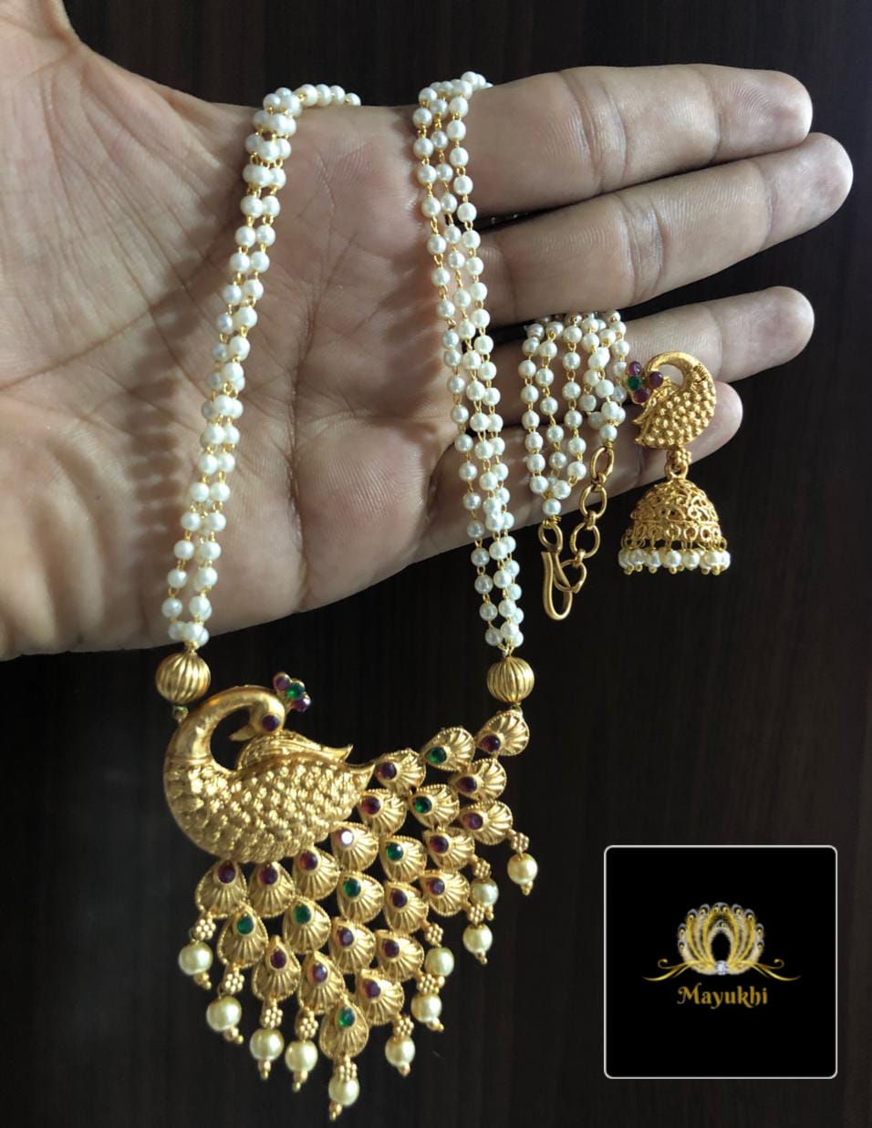 IMG-20240717-WA0017 DOUBLE LAYER PEARL CHAIN WITH PEACOCK PENDENT - Image 1